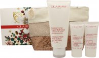 Click to view product details and reviews for Clarins body care gift set 200ml moisture rich body lotion 30ml hand and nail treatment cream 30ml exfoliating body scrub wash bag.