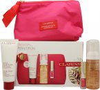 Clarins Beauty Flash Balm Holidays Gift Set 1.7oz (50ml) Beauty Flash Balm + 1.7oz (50ml) Gentle Renewing Cleansing Mousse + 0.0oz (1.4ml) Lip Comfort Oil - 04 Pitaya + Bag